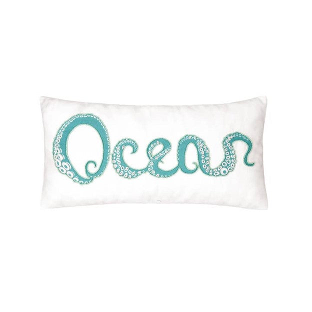 A rectangular throw pillow with the word 'ocean' written in a stylized font, where each letter is replaced with an embroidered octopus tentacle design in turquoise color on a white background.