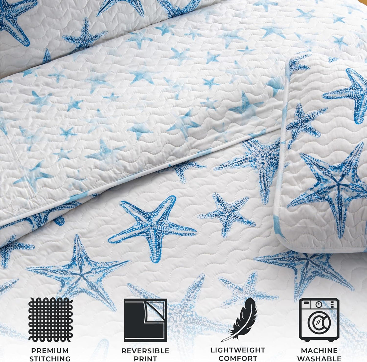 A lightweight quilt set featuring a coastal starfish design in blue on a white background, with two matching pillow shams.  Known as the Trinidad C3 piece Collection.