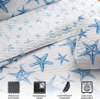 A lightweight quilt set featuring a coastal starfish design in blue on a white background, with two matching pillow shams.  Known as the Trinidad C3 piece Collection.