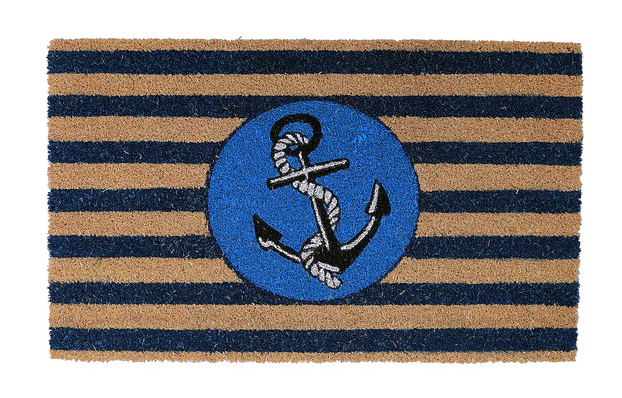 A coir door mat with blue stripes and a central anchor design, placed on a doorstep.