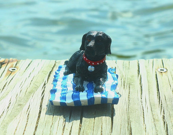 Black Dog on Beach Towel Ceramic Christmas Ornament