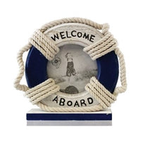 A nautical-themed picture frame shaped like a life saver with white rope detailing and a flat wood base, labeled 'Welcome Aboard'.