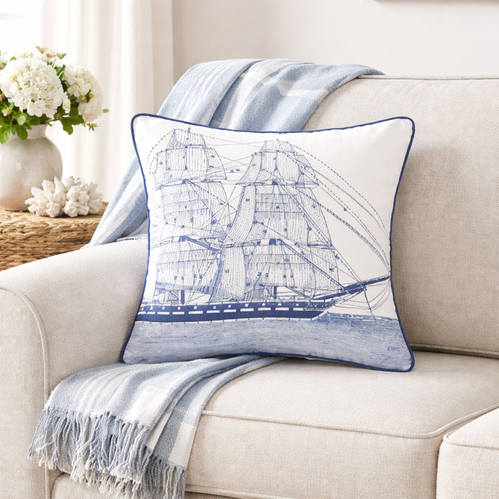 Decorative pillow with ship design on a beige sofa