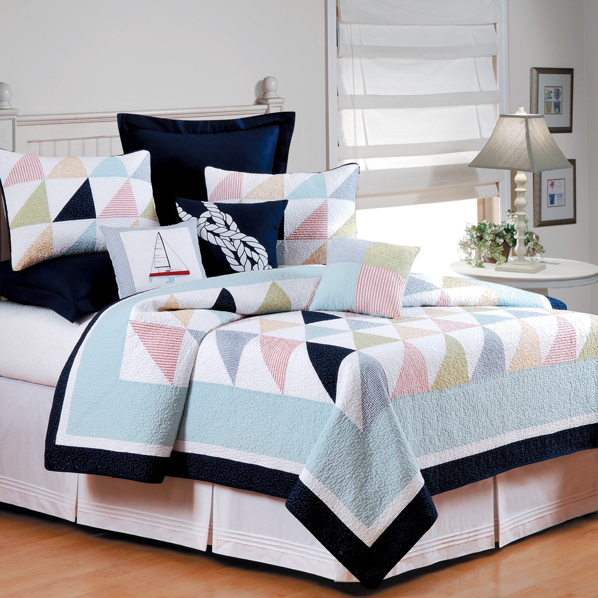 Nautical style bold color block pattern quilts in navy, blue, green and red.