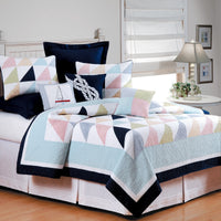 Nautical style bold color block pattern quilts in navy, blue, green and red.
