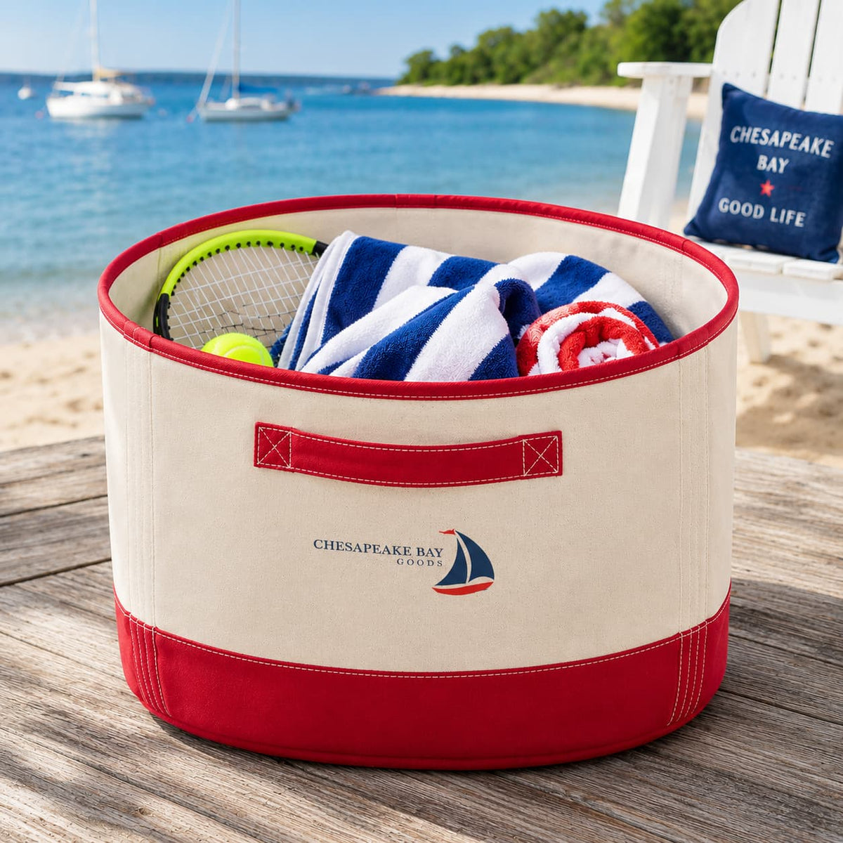 Heavy Canvas Red Storage Bin with Handles on deck with towels