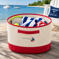 Heavy Canvas Red Storage Bin with Handles on deck with towels